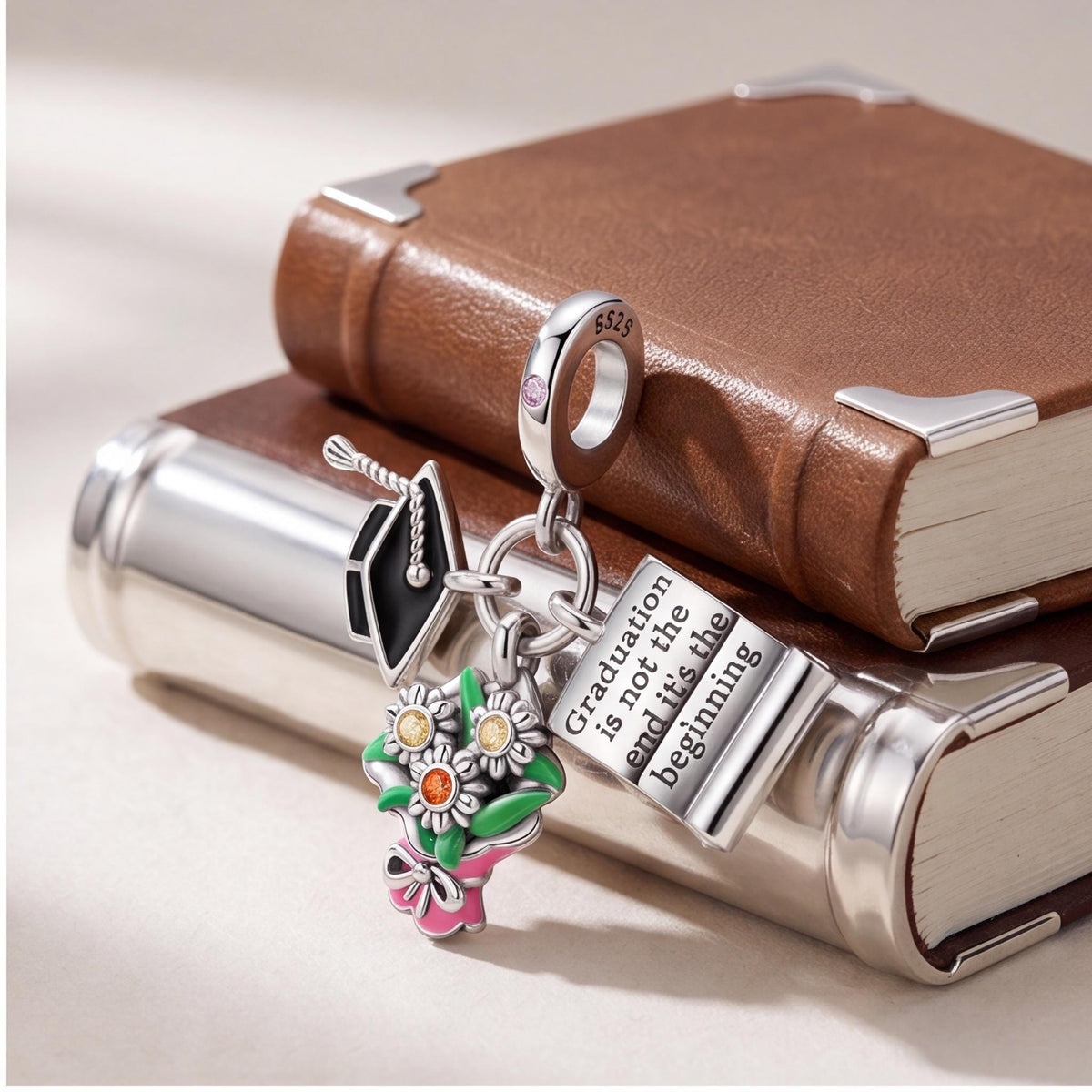 Graduation Dangle Charm close-up on a bracelet