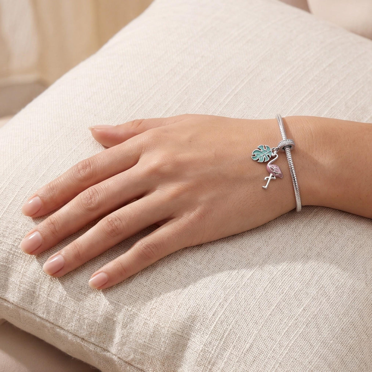Flamingo Dangle Charm worn on a charm bracelet