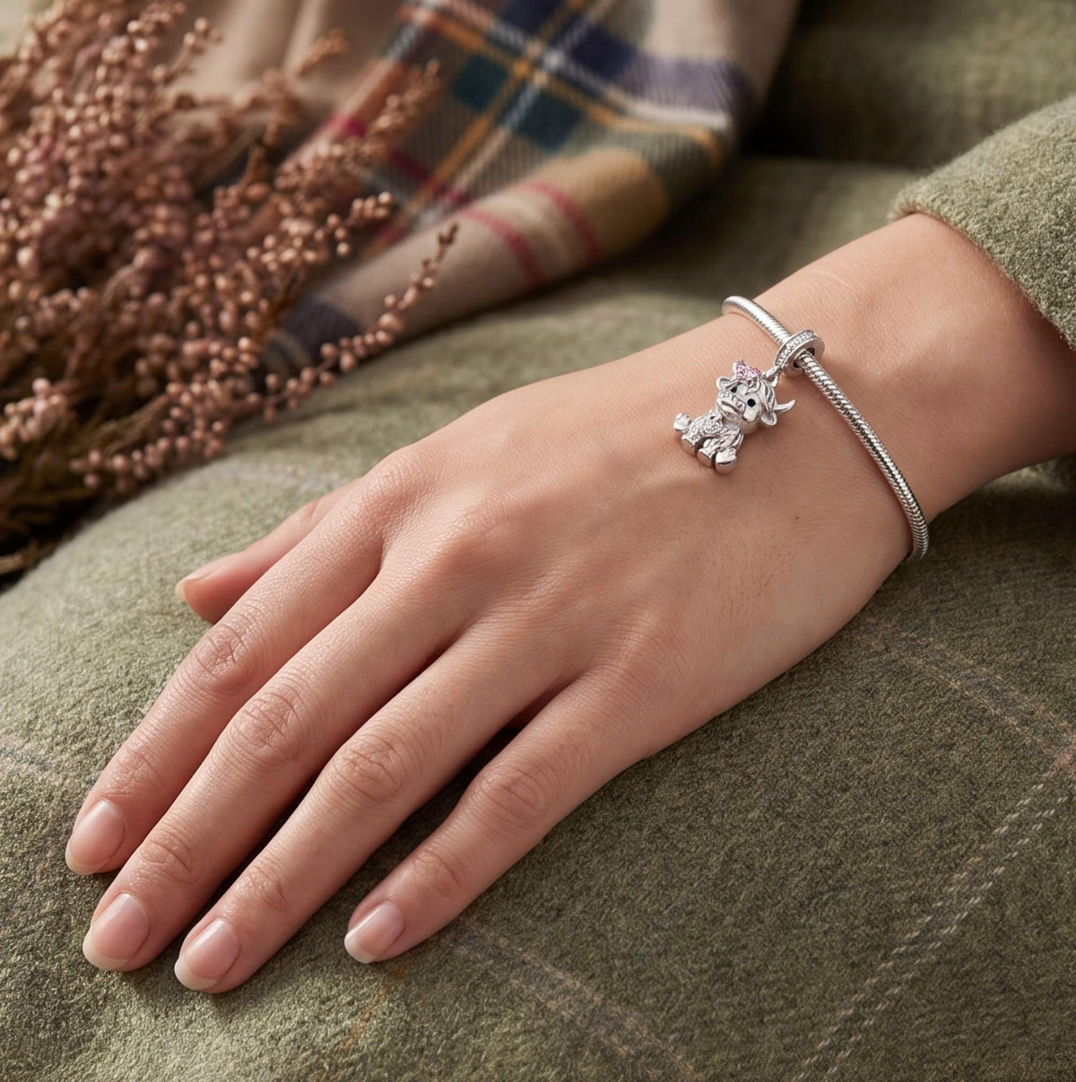 Highland Cow Dangle close-up on a bracelet