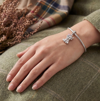 Highland Cow Dangle close-up on a bracelet