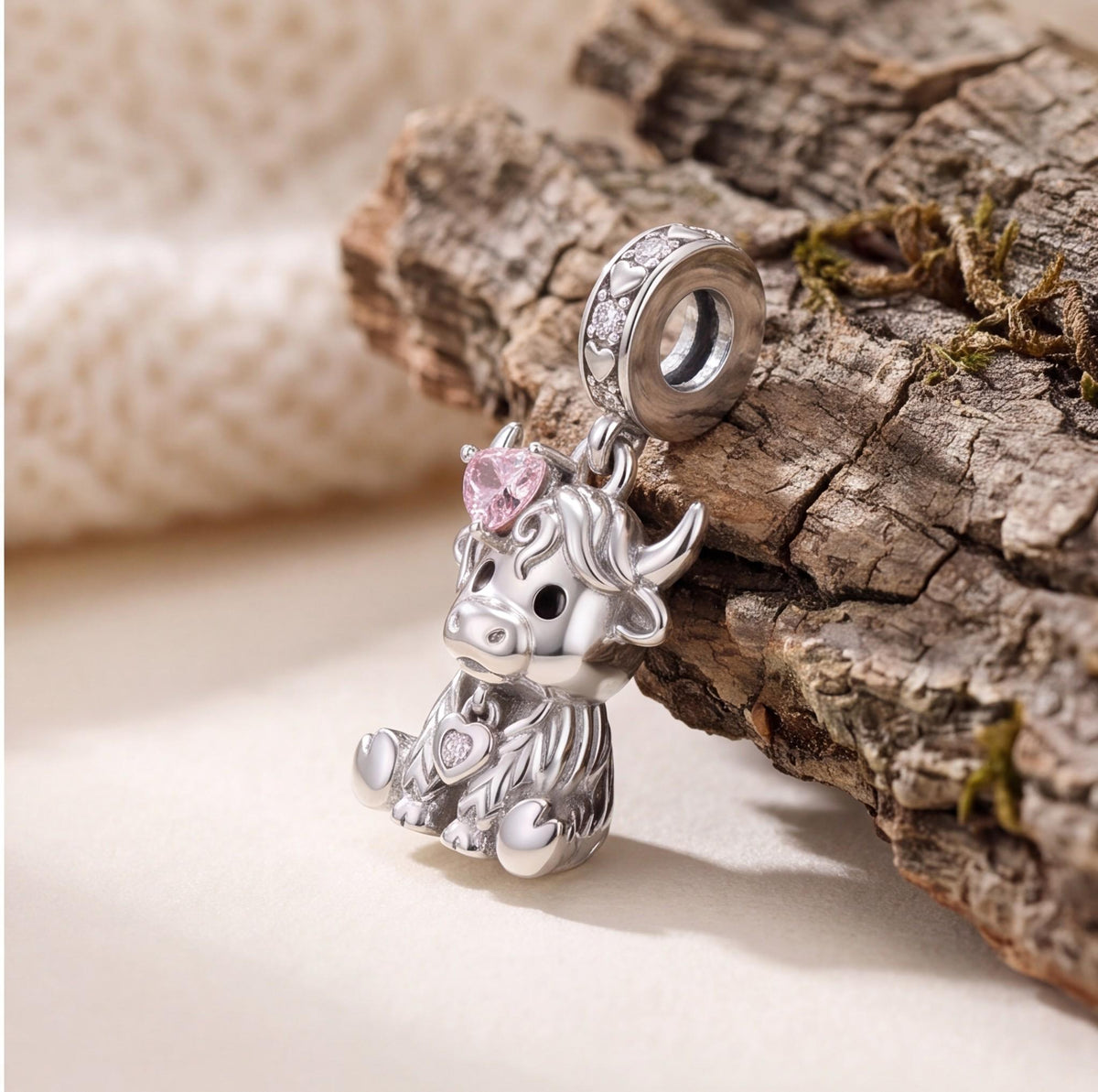 Highland Cow Dangle on a silver charm bracelet