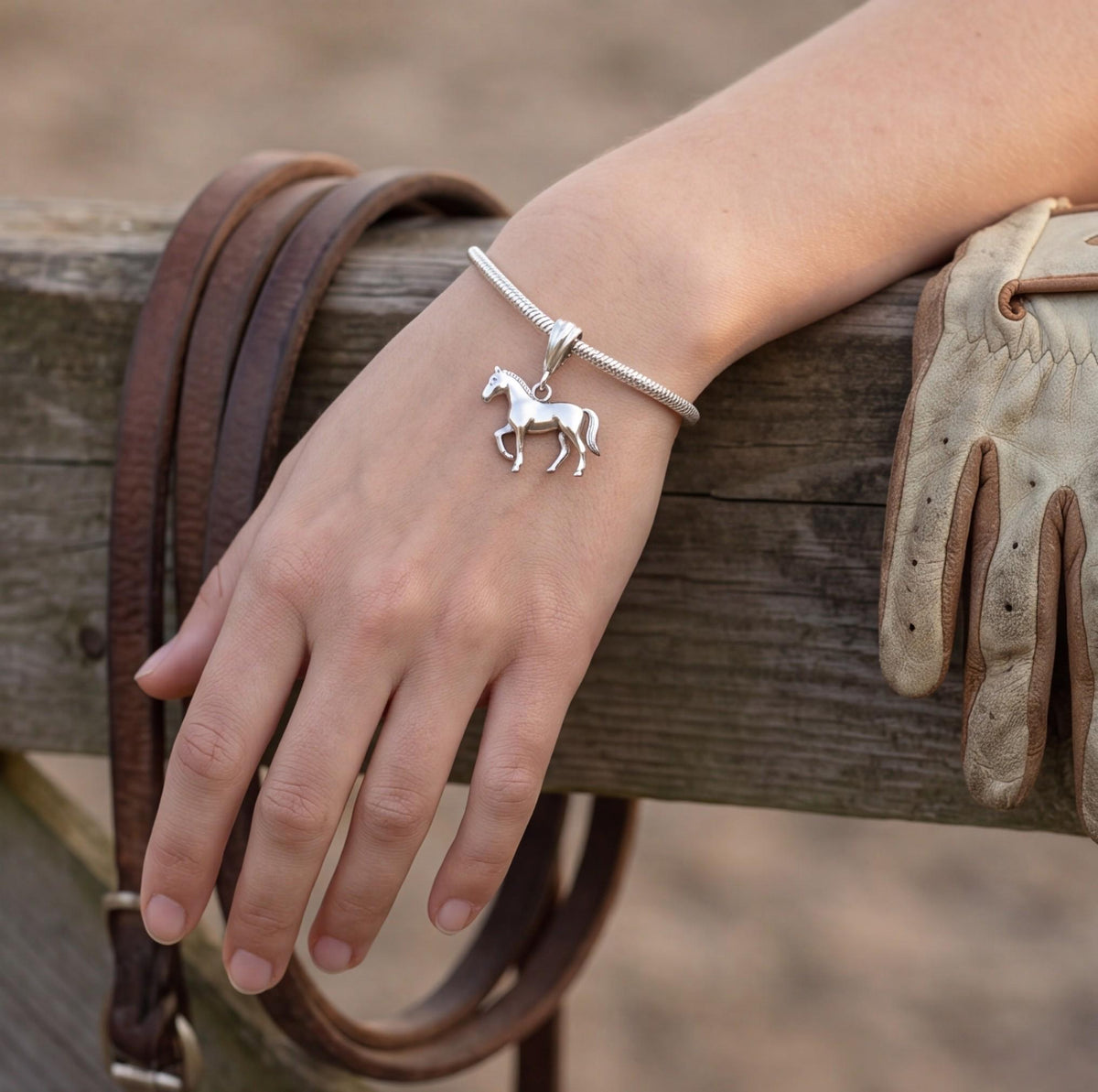 Galloping Horse Charm close-up on a bracelet