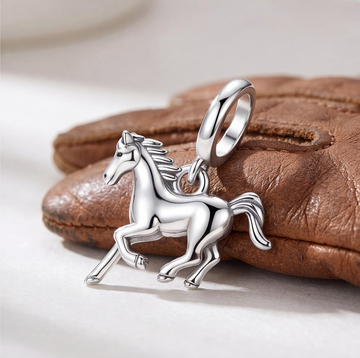 Galloping Horse Charm on a silver charm bracelet