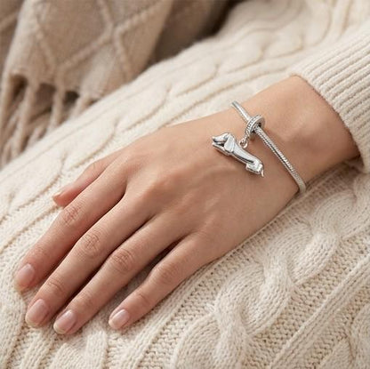 Lying Dachshund Dangle close-up on a bracelet