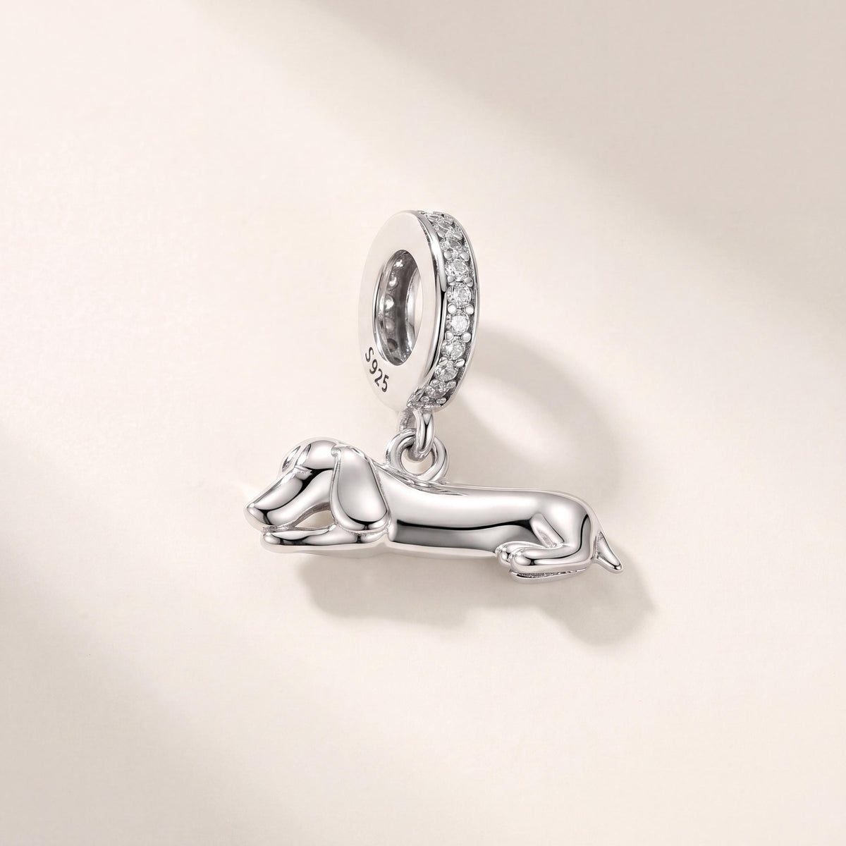 Lying Dachshund Dangle in 925 sterling silver with sparkling stones, fits European-style charm bracelets