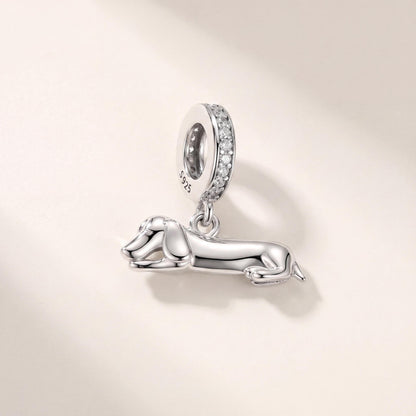 Lying Dachshund Dangle in 925 sterling silver with sparkling stones, fits European-style charm bracelets