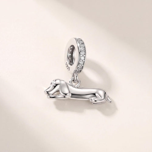 Lying Dachshund Dangle in 925 sterling silver with sparkling stones, fits European-style charm bracelets