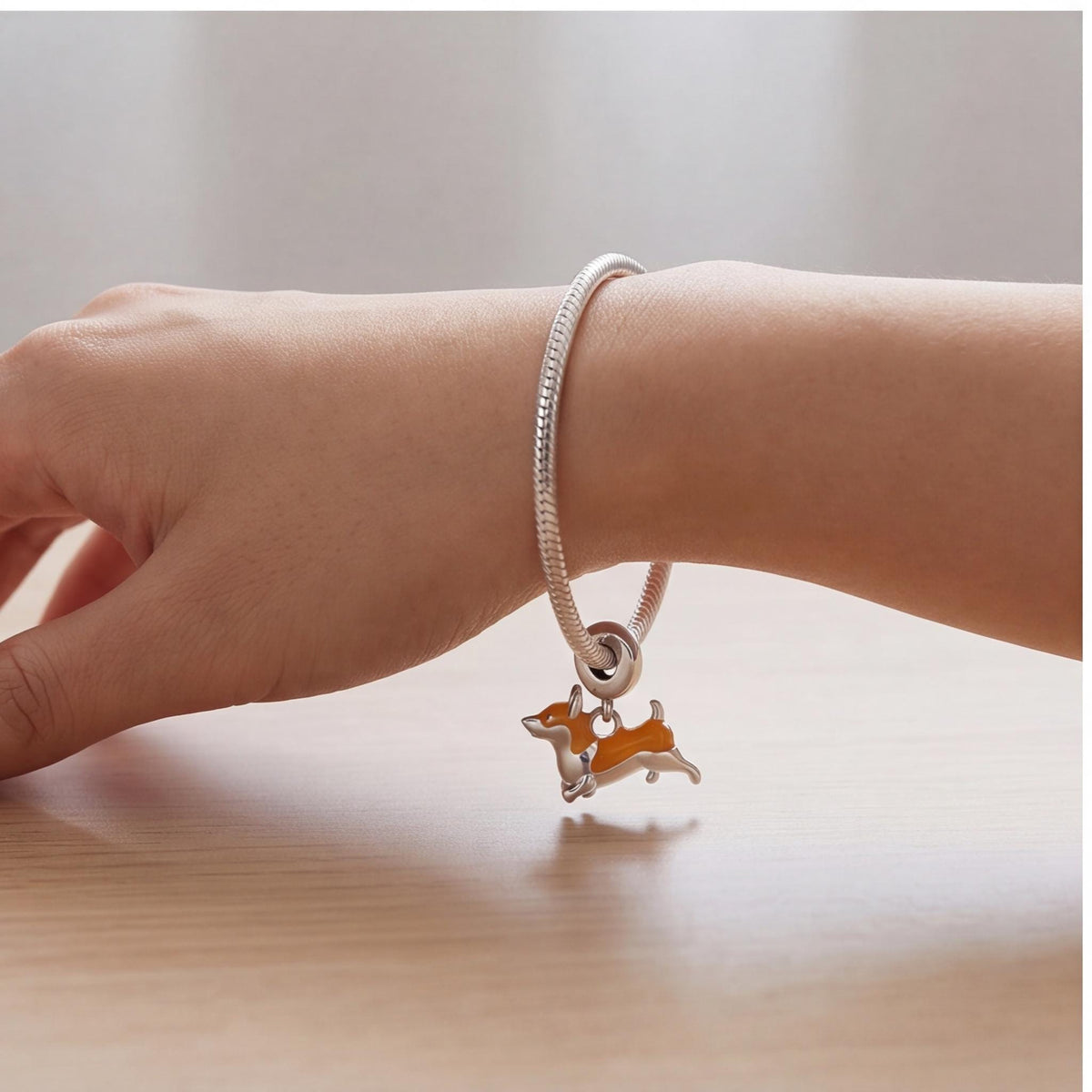 Corgi Dangle Charm on a silver charm bracelet