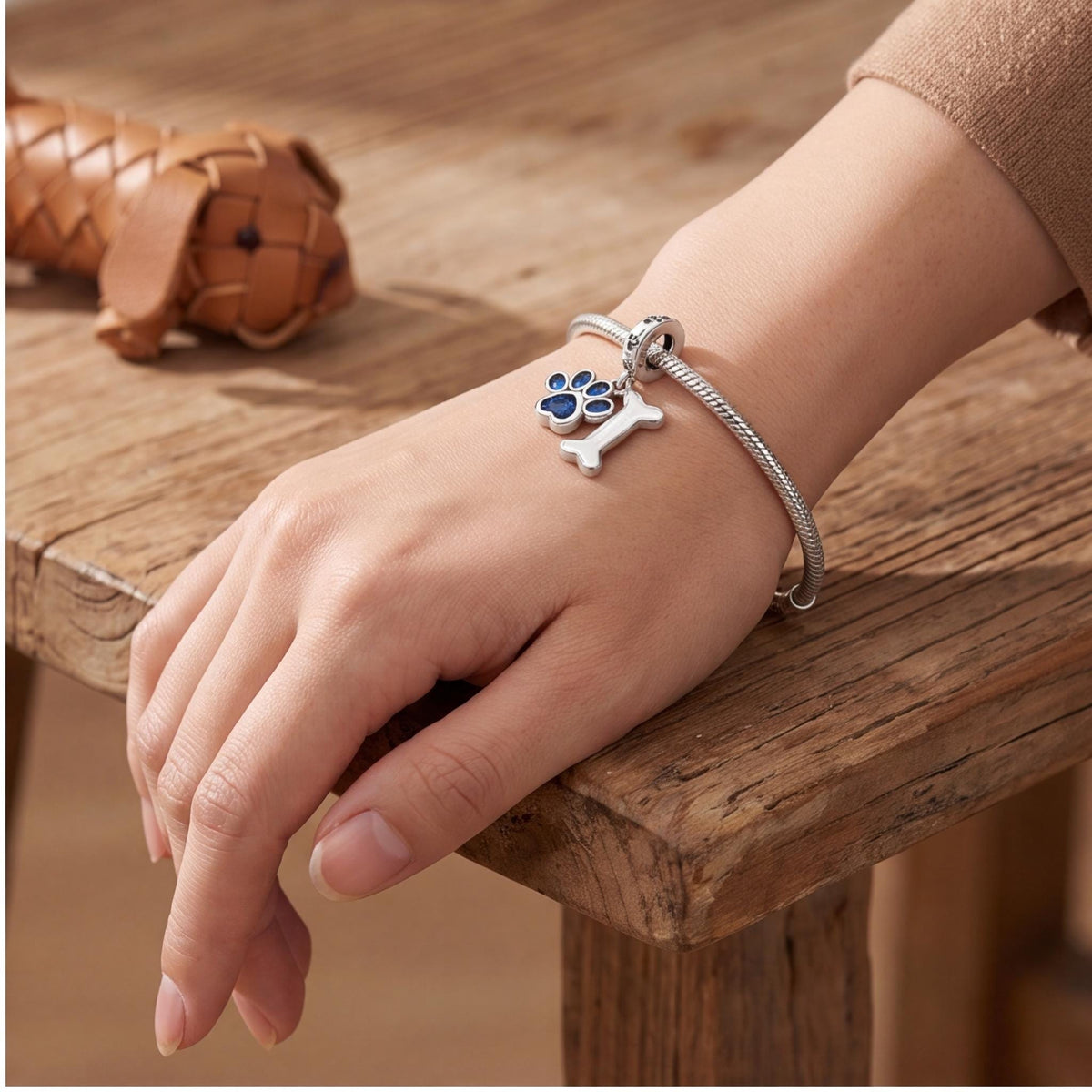 Blue Paw Print Bone Dangle styled as a gift