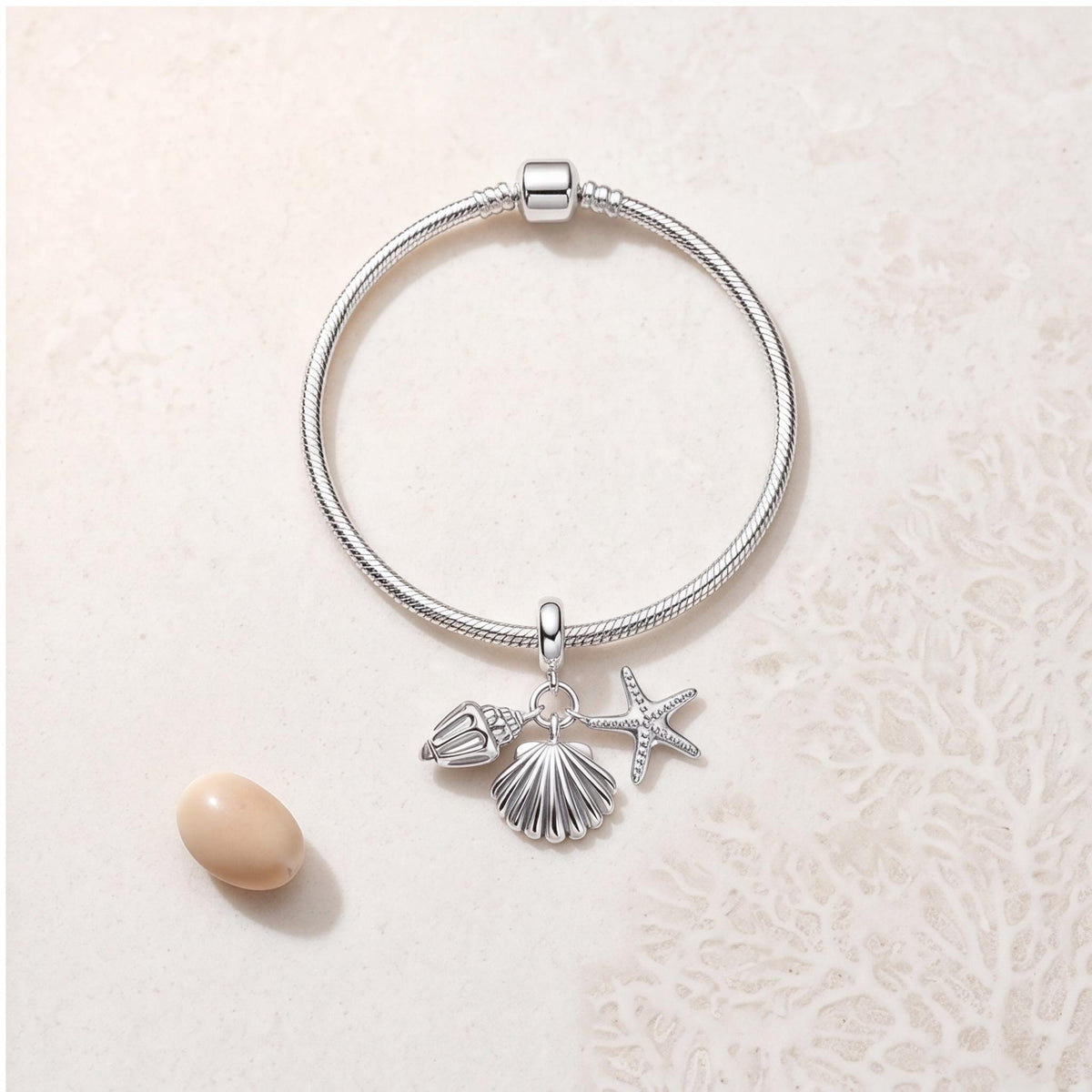 Starfish Shell Dangle on a silver charm bracelet