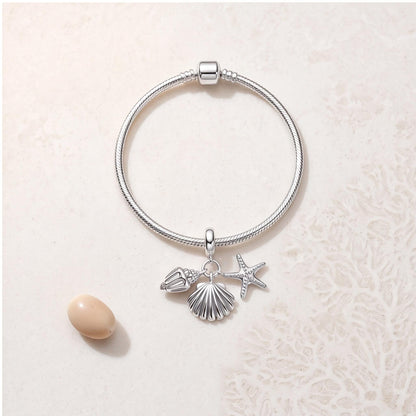 Starfish Shell Dangle on a silver charm bracelet
