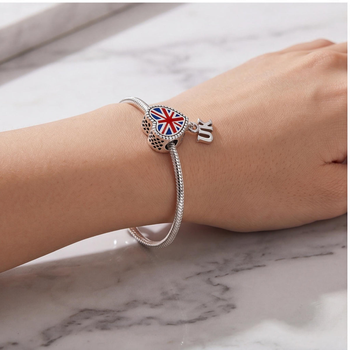 Union Jack Heart Dangle worn on a charm bracelet