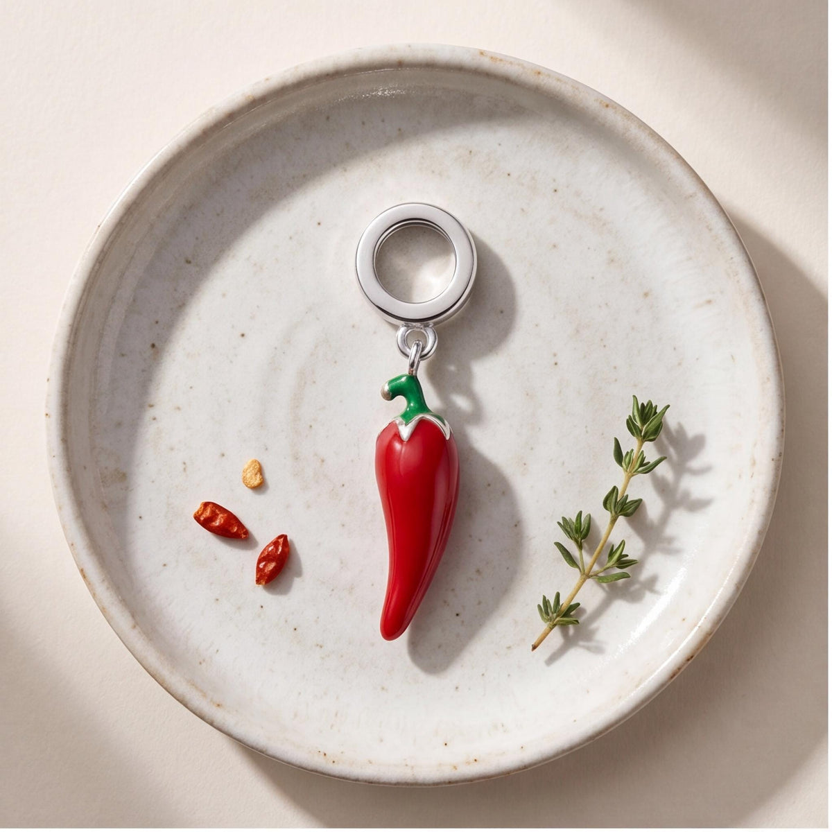 Red Chilli Pepper Charm close-up on a bracelet