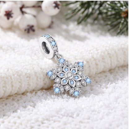 Blue Snowflake Dangle Charm on a silver charm bracelet