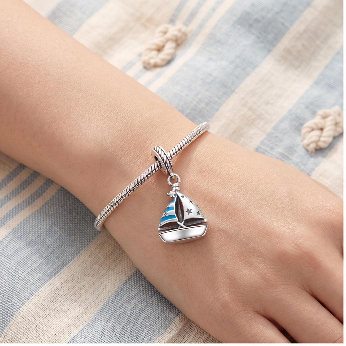 Sailboat Dangle Charm worn on a charm bracelet