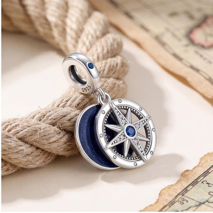 Compass Heart Dangle Charm worn on a charm bracelet