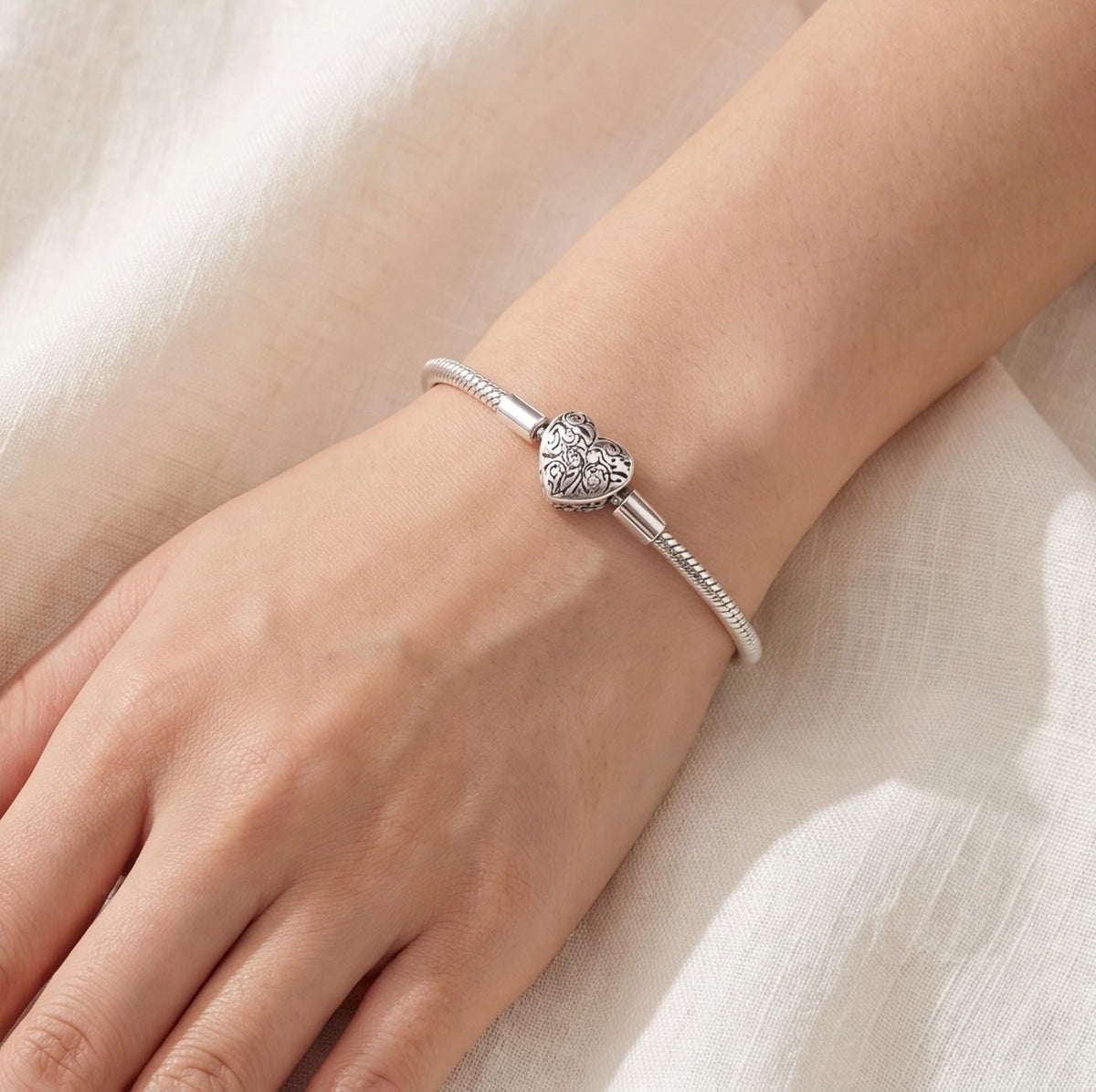 Heart Clasp Charm worn on a charm bracelet
