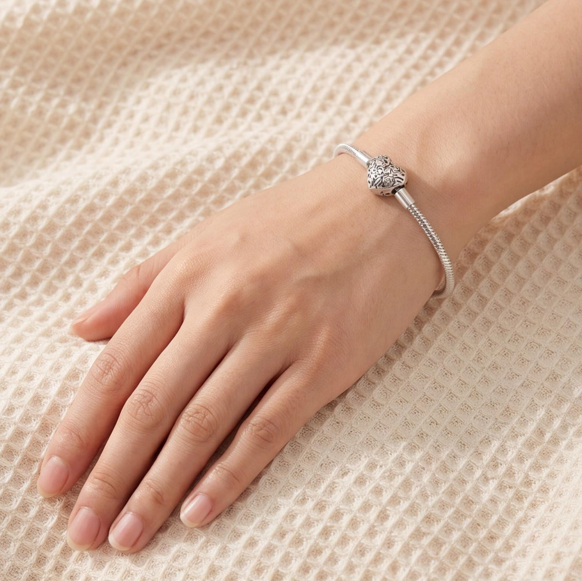 Heart Clasp Charm close-up on a bracelet
