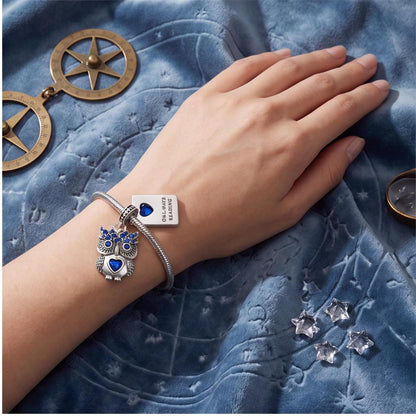 Owl Reading Book Charm on a bracelet with other charms