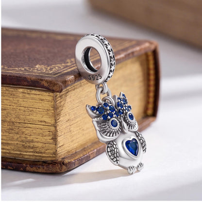 Owl Reading Book Charm on a silver charm bracelet