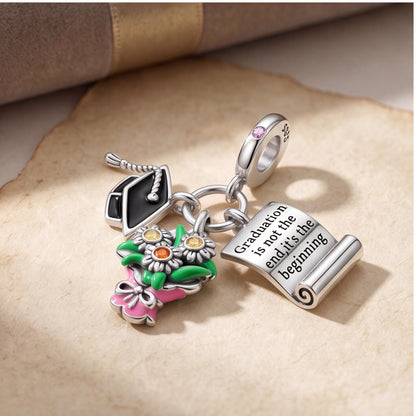 Graduation Dangle Charm on a silver charm bracelet