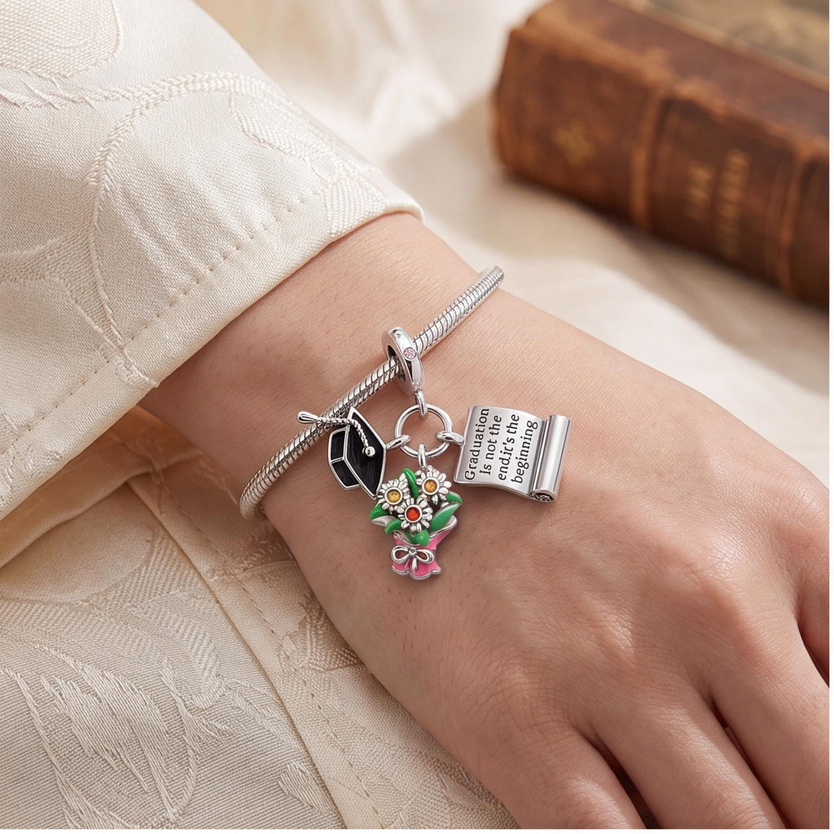 Graduation Dangle Charm worn on a charm bracelet