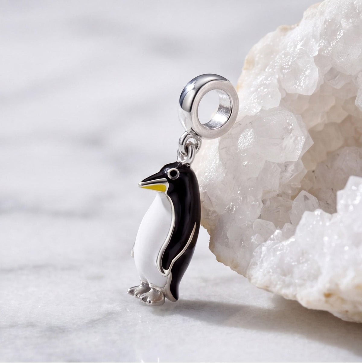 Penguin Dangle Charm on a silver charm bracelet