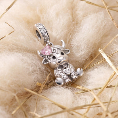 Highland Cow Dangle on a bracelet with other charms