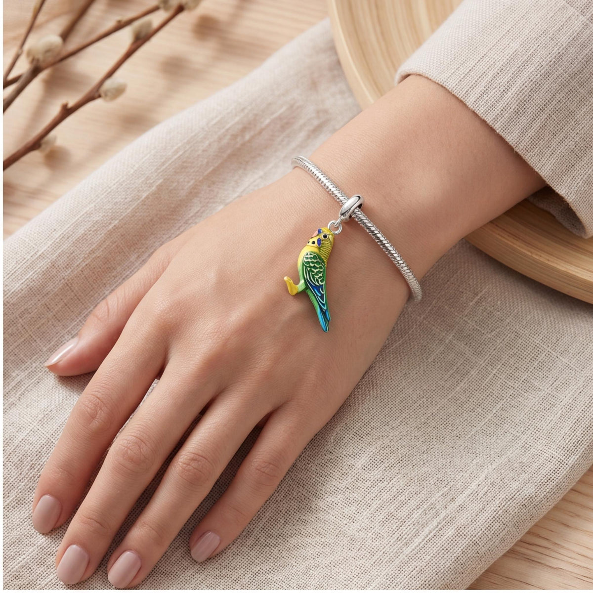 Budgerigar Dangle worn on a charm bracelet