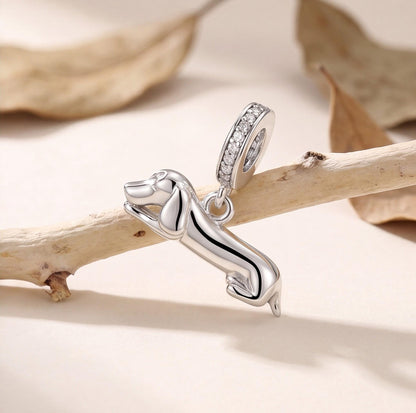 Lying Dachshund Dangle on a silver charm bracelet