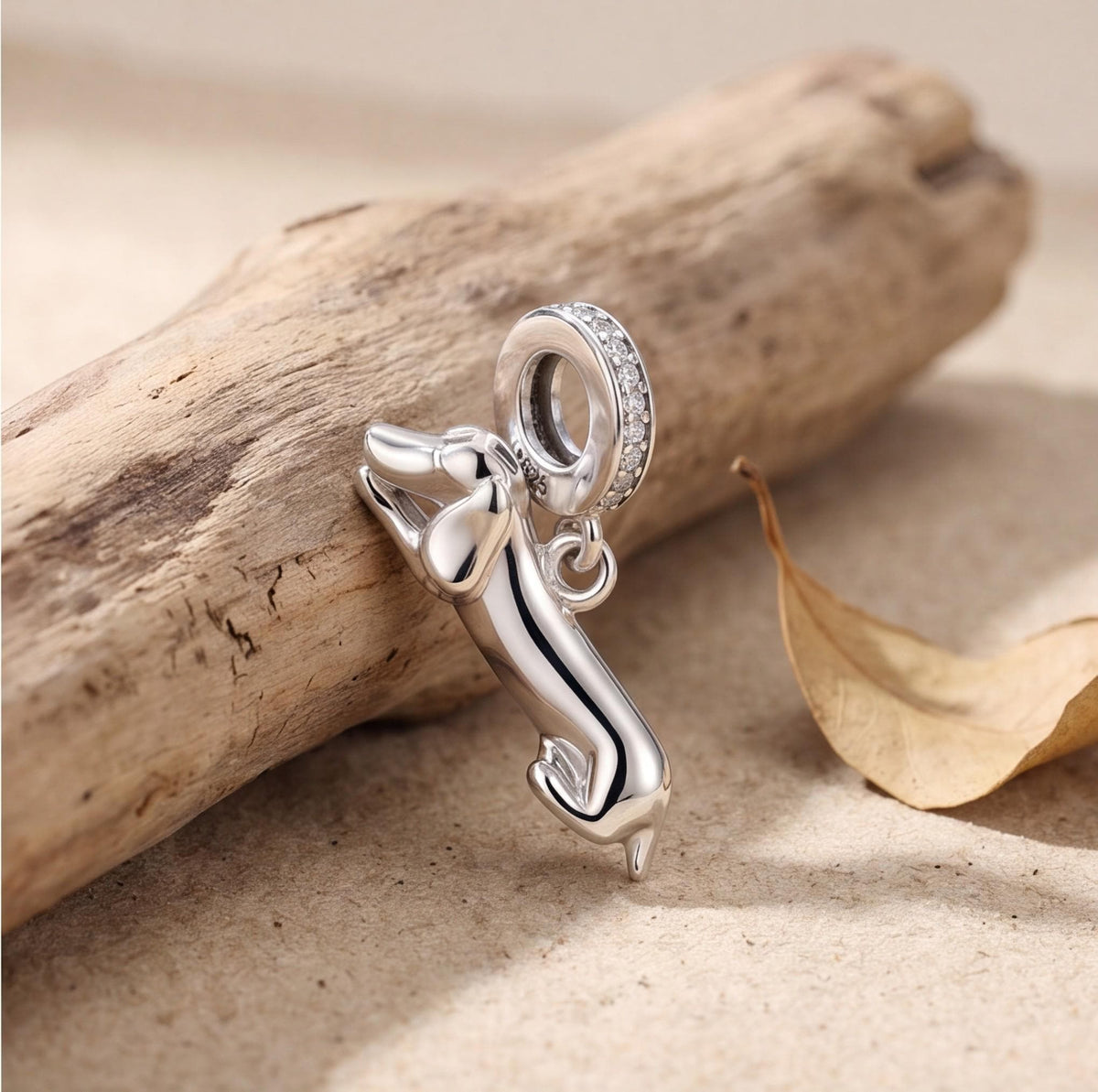Lying Dachshund Dangle styled as a gift