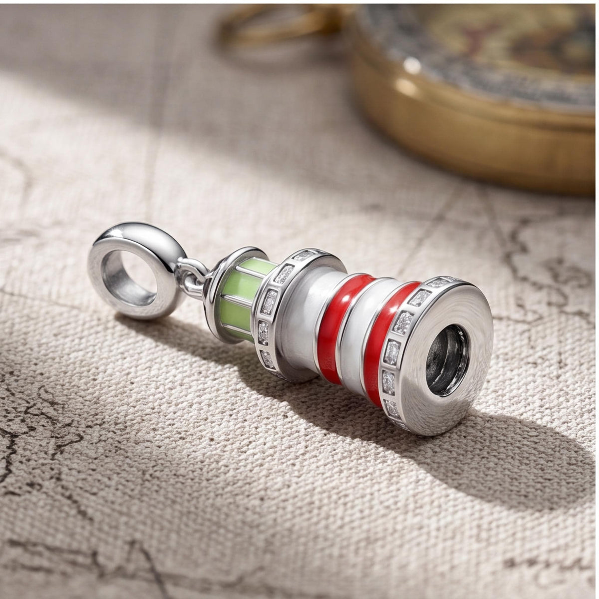 Red Enamel Lighthouse Dangle close-up on a bracelet