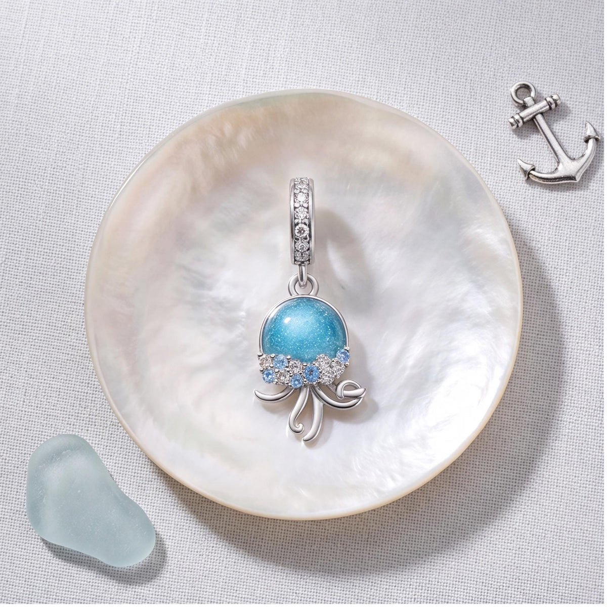 Jellyfish Dangle Charm on a silver charm bracelet