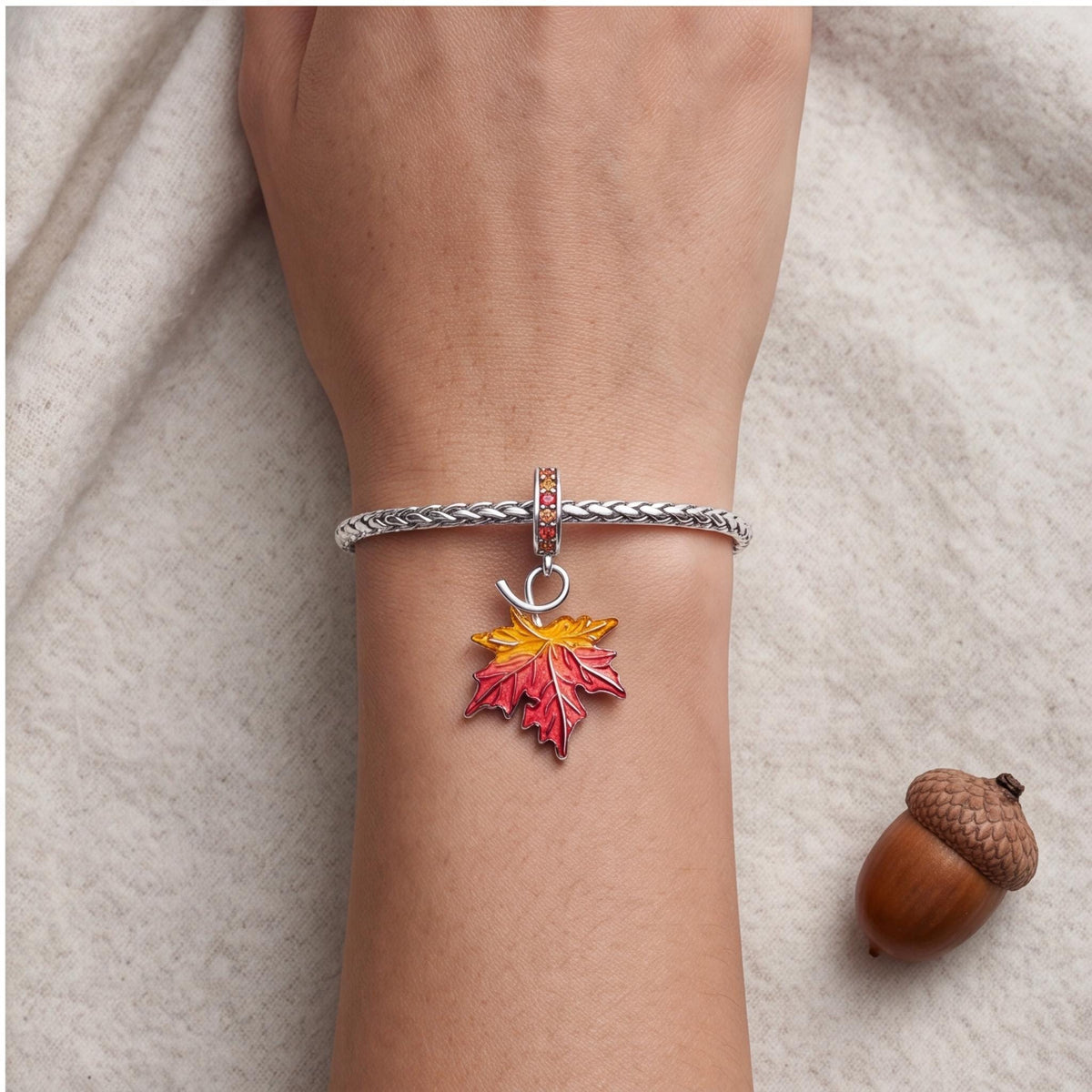 Autumn Maple Leaf Charm worn on a charm bracelet