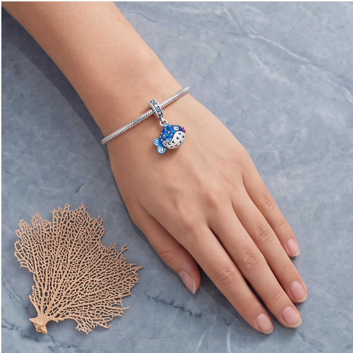 Puffer Fish Dangle Charm close-up on a bracelet