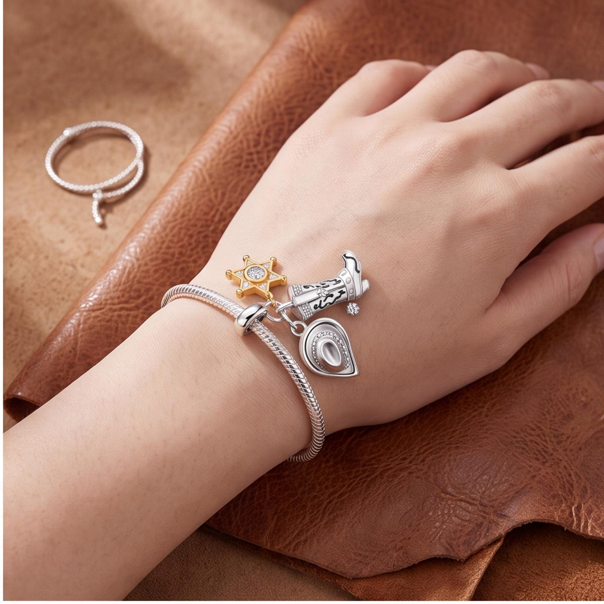 Cowboy Triple Dangle worn on a charm bracelet