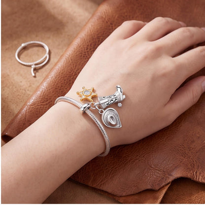 Cowboy Triple Dangle worn on a charm bracelet