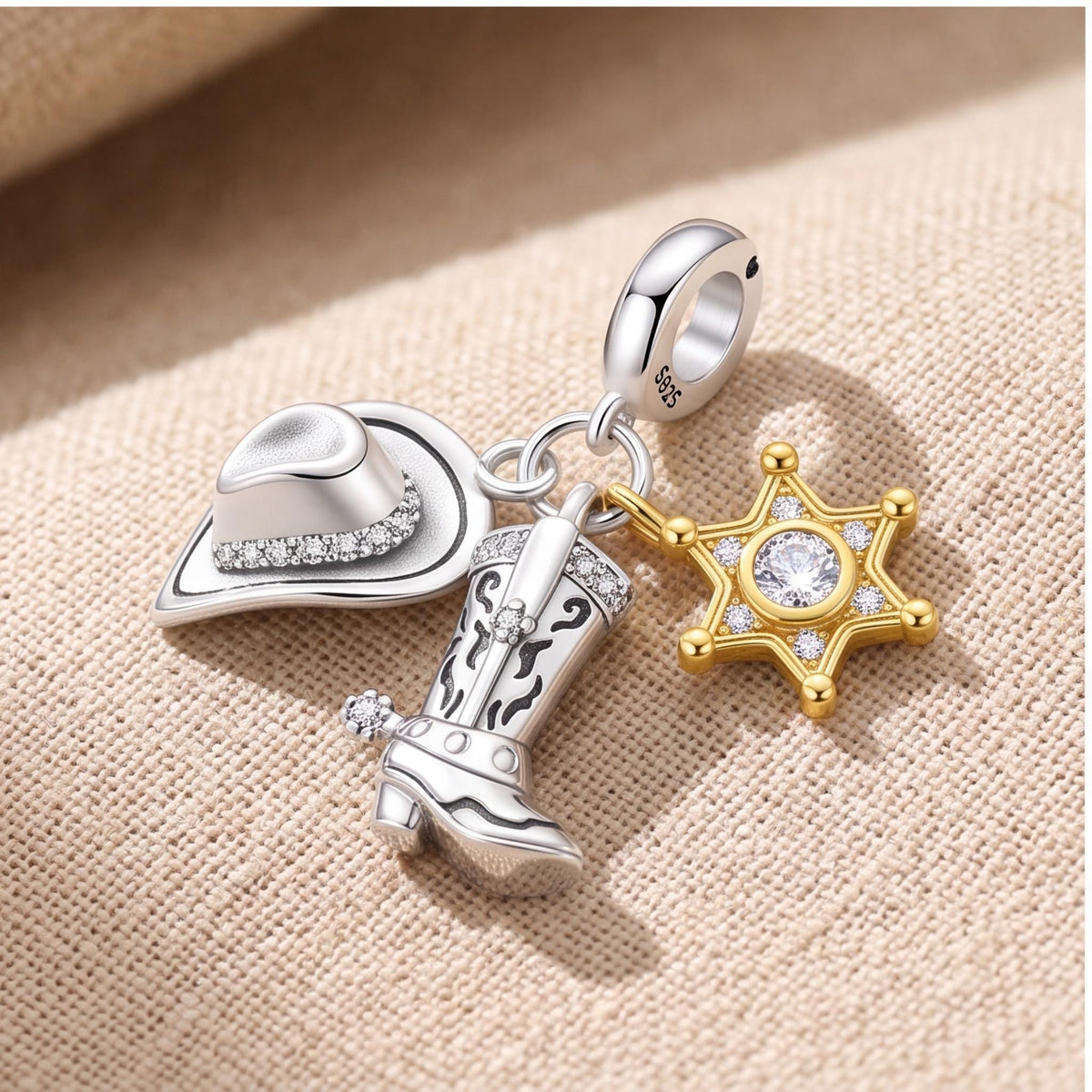 Cowboy Triple Dangle on a silver charm bracelet