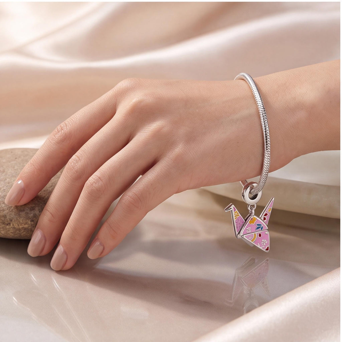 Origami Crane Dangle worn on a charm bracelet