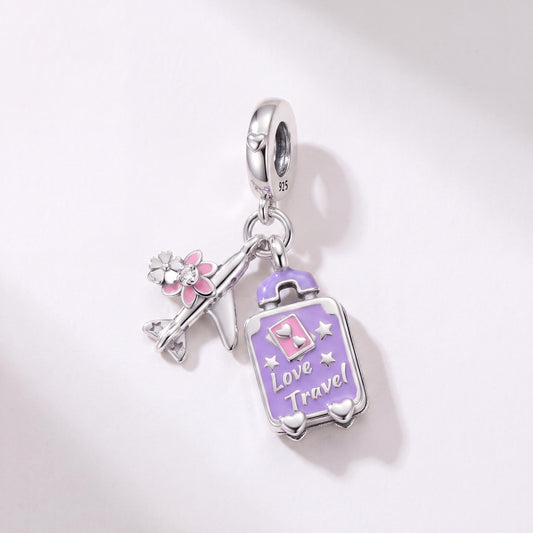 Purple Suitcase Plane Dangle in 925 sterling silver with purple and pink enamel and sparkling stones