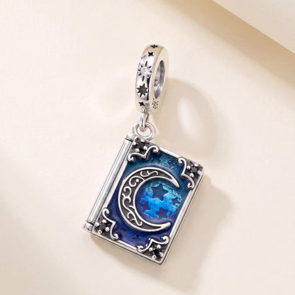 Magic Book Moon Charm in 925 sterling silver with blue and black enamel and sparkling stones