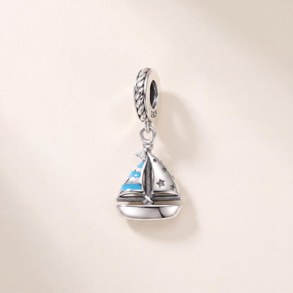 Sailboat Dangle Charm in 925 sterling silver with blue enamel and sparkling stones, fits European-style charm bracelets