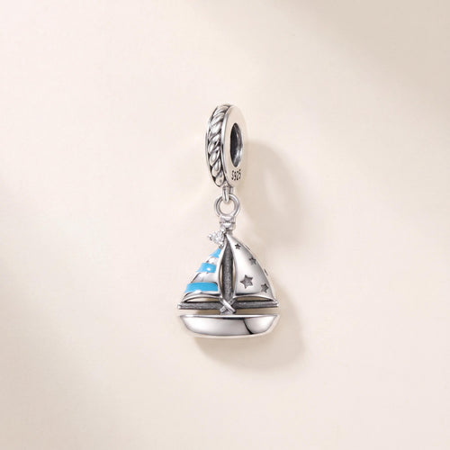 Sailboat Dangle Charm in 925 sterling silver with blue enamel and sparkling stones, fits European-style charm bracelets