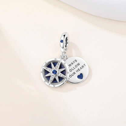 Compass Heart Dangle Charm in 925 sterling silver with blue enamel and sparkling stones, fits European-style charm bracelets