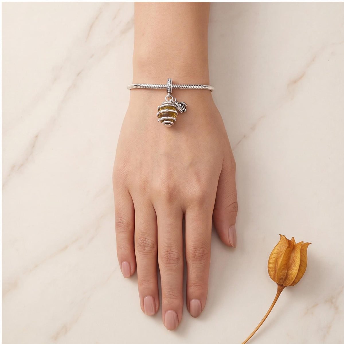 Bee Hive Dangle Charm worn on a charm bracelet