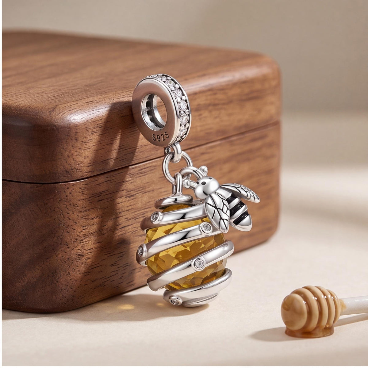 Bee Hive Dangle Charm on a silver charm bracelet