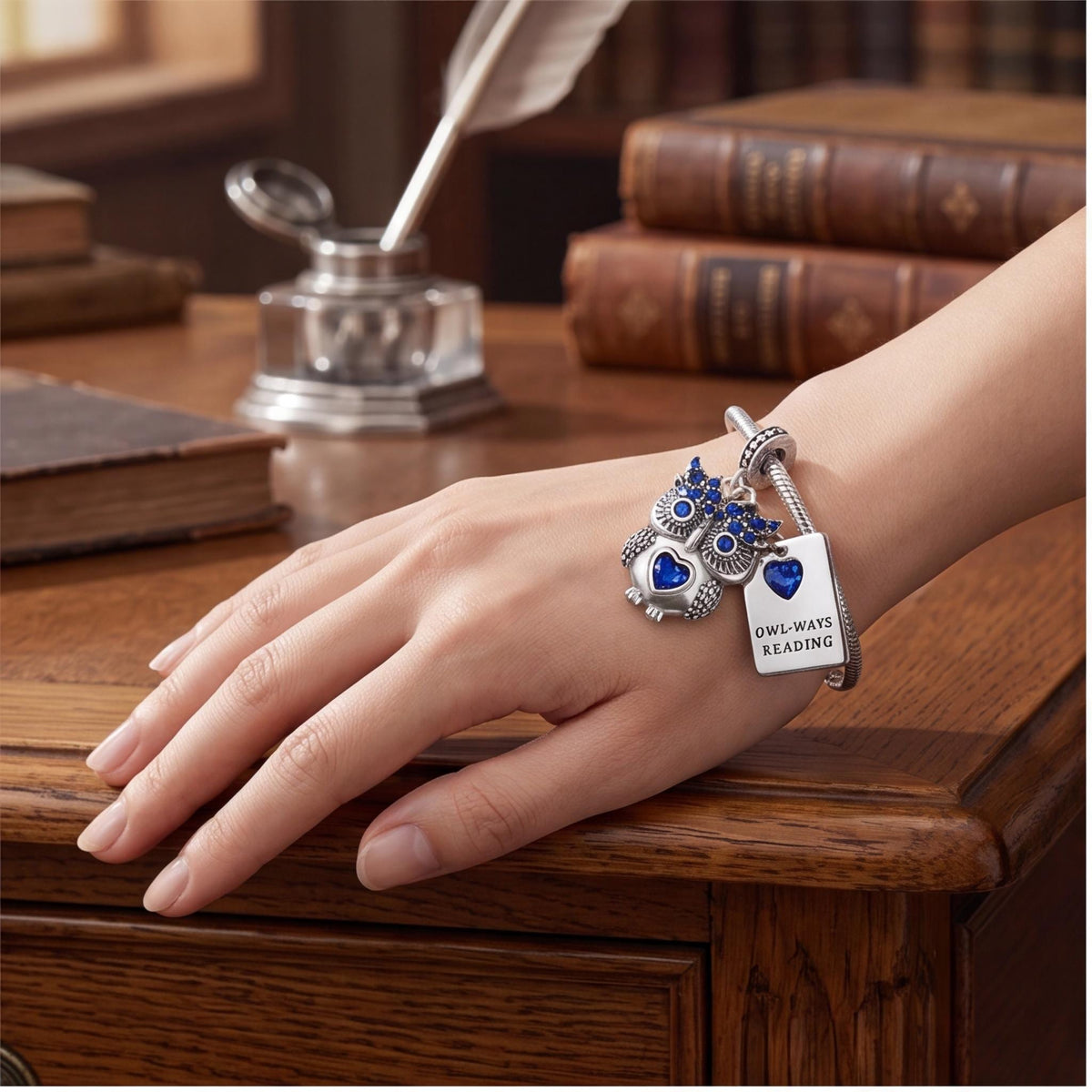 Owl Reading Book Charm close-up on a bracelet