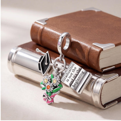 Graduation Dangle Charm close-up on a bracelet