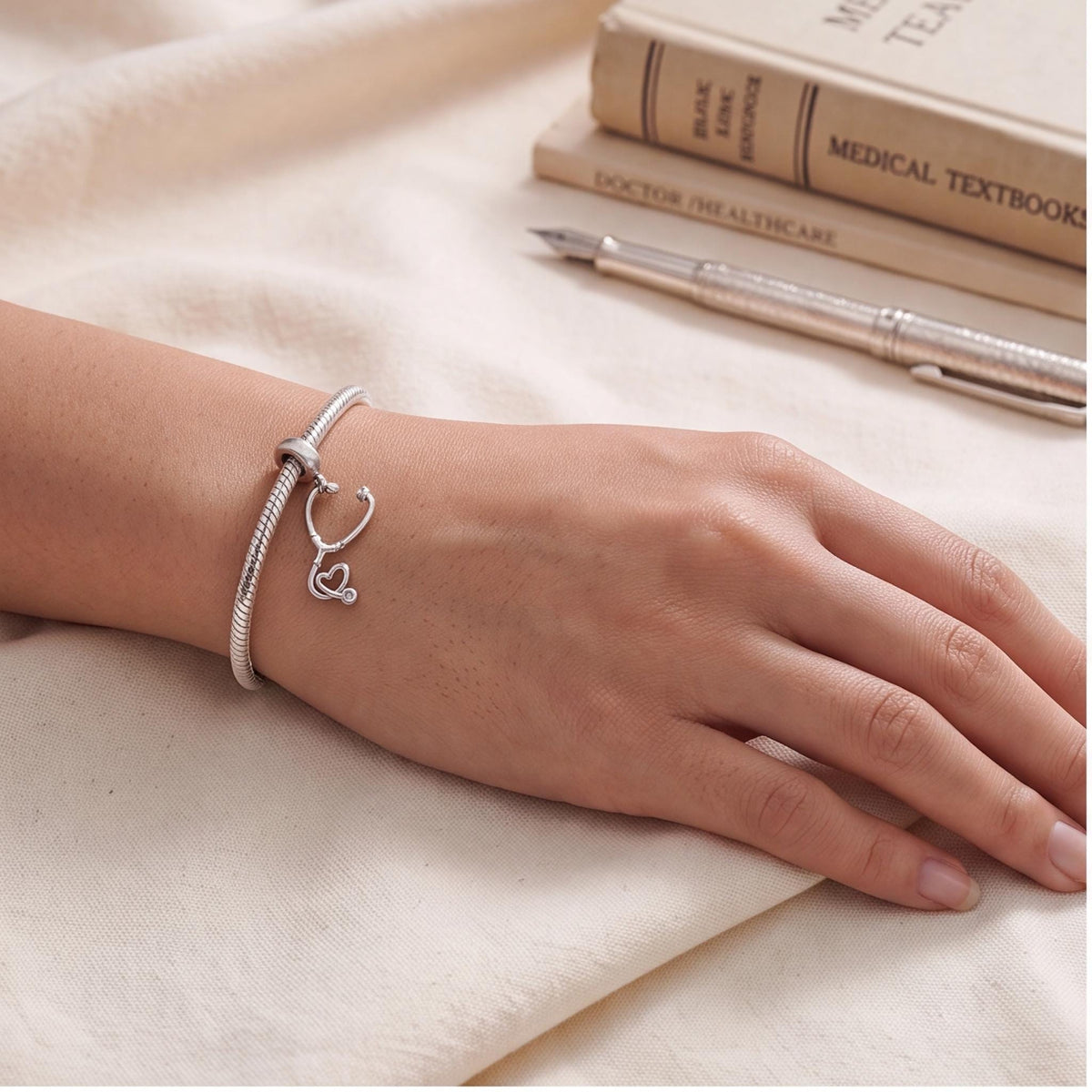 Stethoscope Heart Dangle close-up on a bracelet