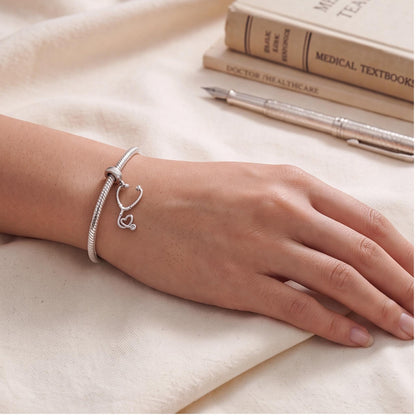 Stethoscope Heart Dangle close-up on a bracelet